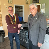 Previous Chair of Council Ernie Brown hands over the Chain of Office to newly elected Chair Councillor Dave Addison for the 2023/24 year