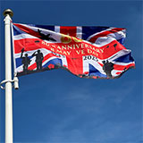 A flag flying in Stoke Gifford commemorating VE Day 80th Anniversary