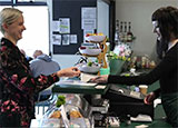 Photo of a customer being served at Brooklands Park Community Café