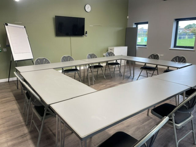 Photo of the Corporate Meeting Room with desk and chairs laid out