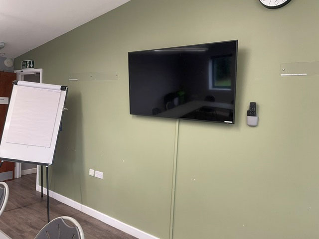 Photo of the Corporate Meeting Room with HDMI-enabled wall-mounted Screen